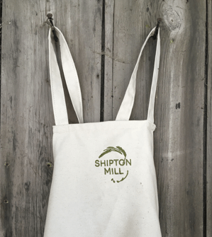 Organic cotton apron with Shipton Mill embroidered on the front