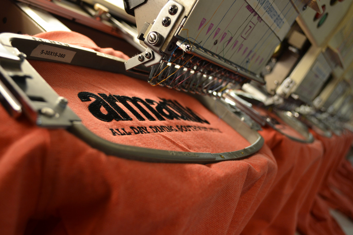 Embroidering a  sample logo on polo shirt